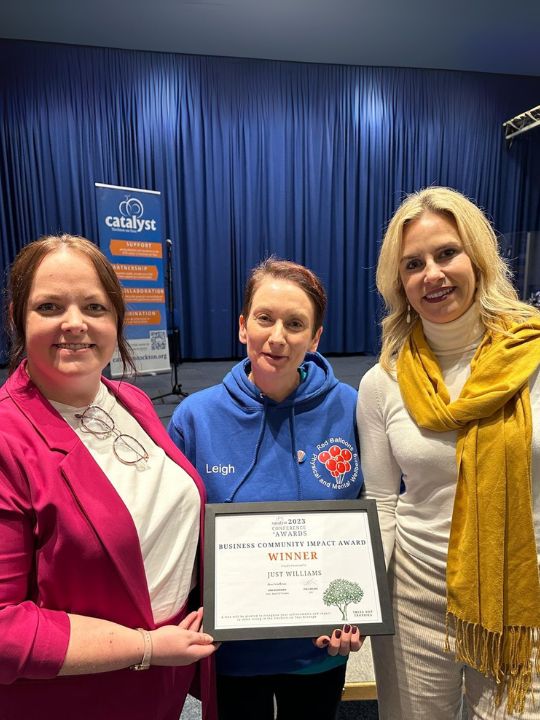 Jessica and Emma Receiving Business Community Impact Award